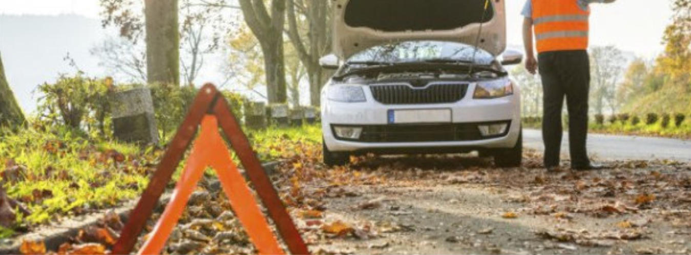 Warning Sign at side of road signalling a broken down vehicle
